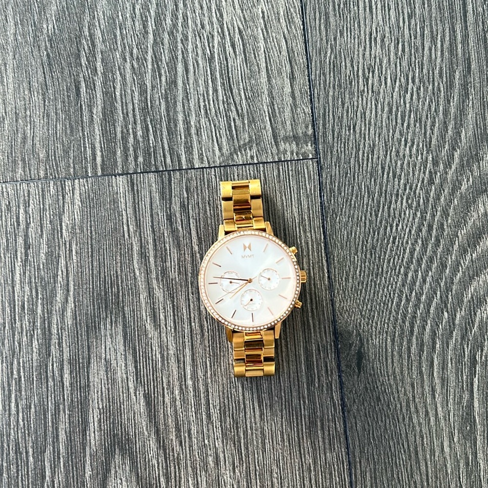 MVNT gold watch with diamond.